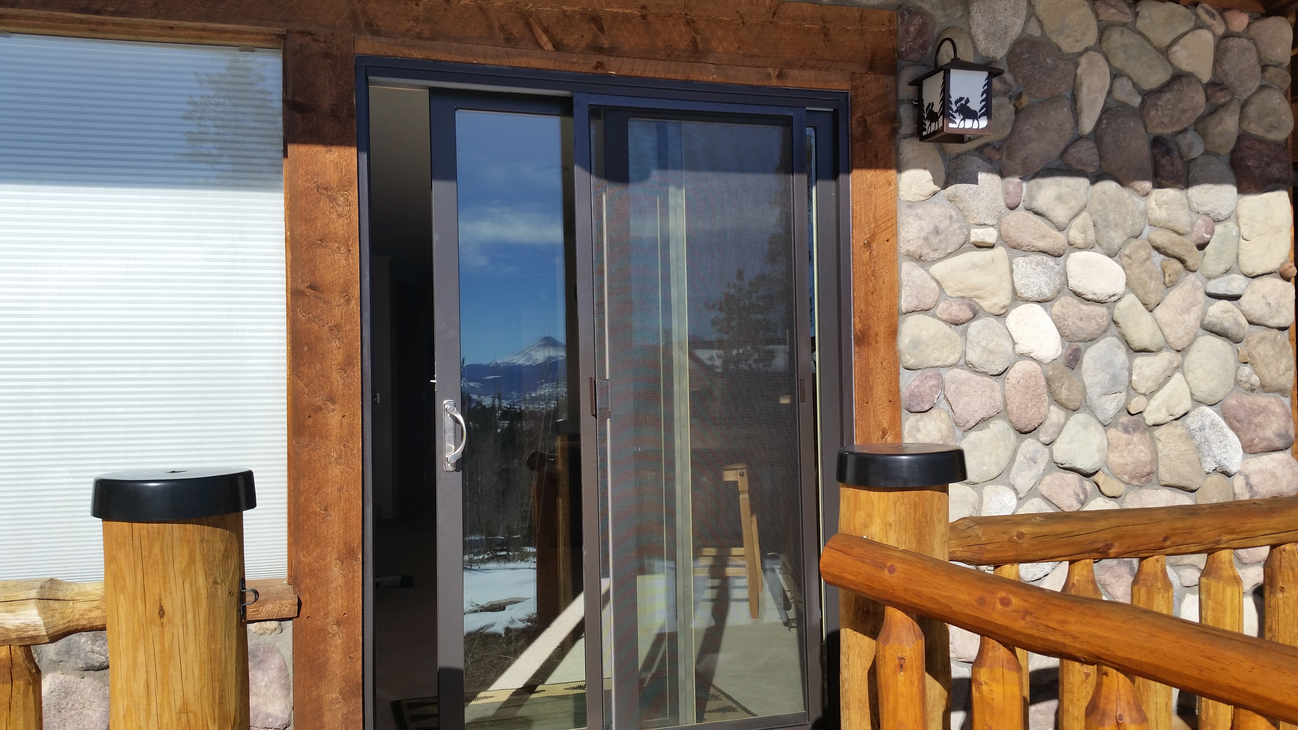 Andersen 200 series NarroLine wood-clad patio door bronze exterior color with brushed nickel handle