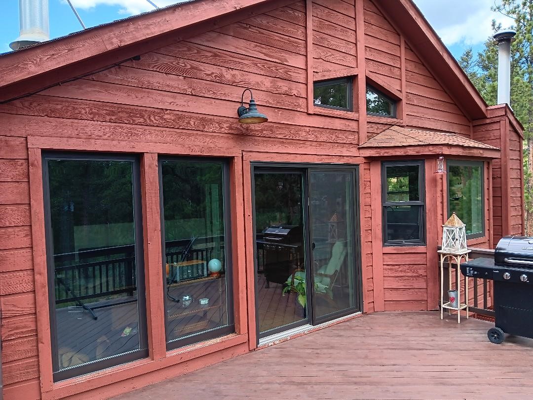 Bailey, CO. Andersen 100 series fibrex composite windows and patio door exterior color Bronze