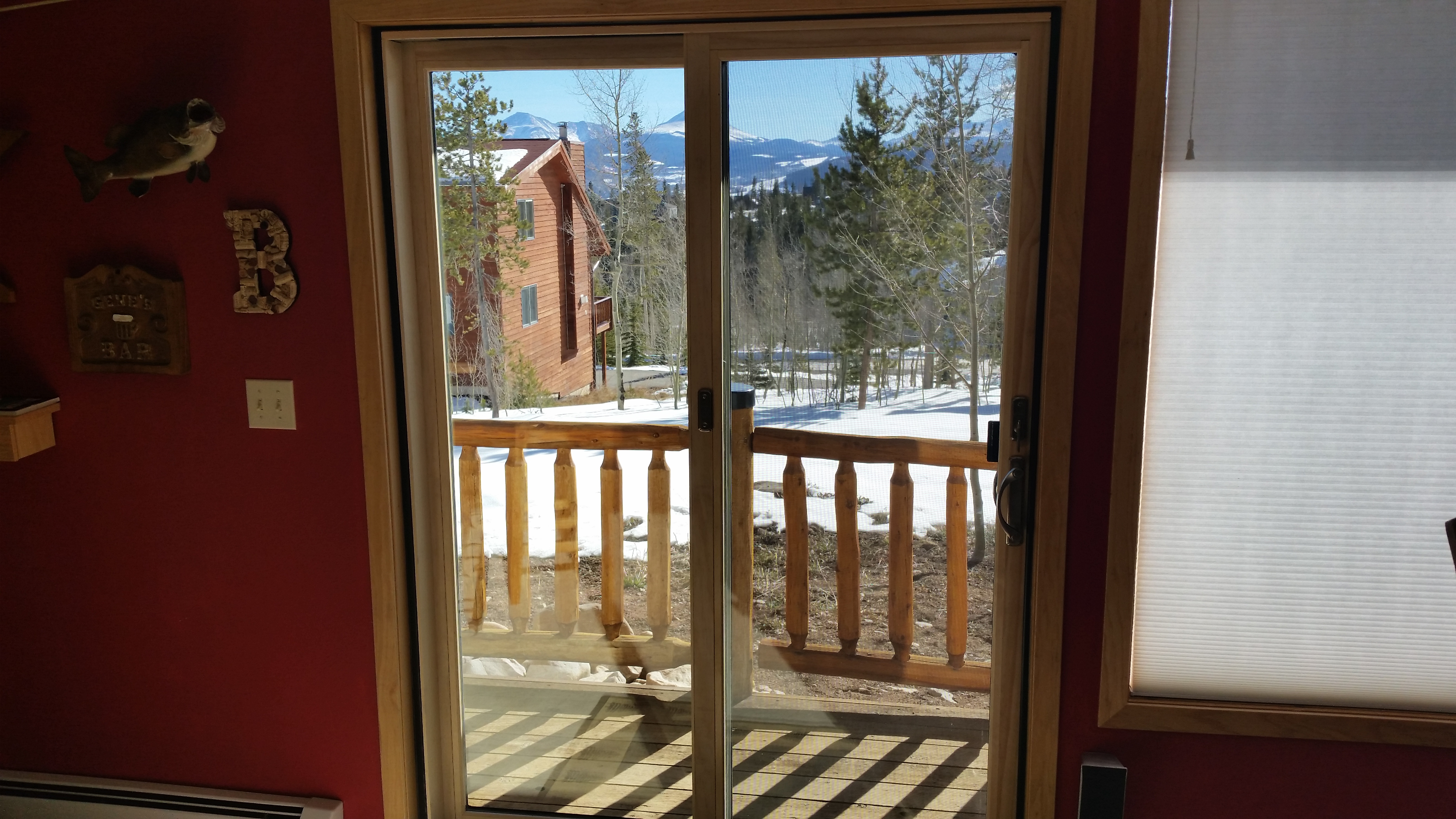 Breckenridge, CO. Andersen 200 series NarroLine wood-clad patio door natural pine interior 