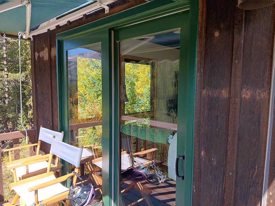 Breckenridge, CO. Andersen A-series patio sliding door color Forest Green with Bronze handle