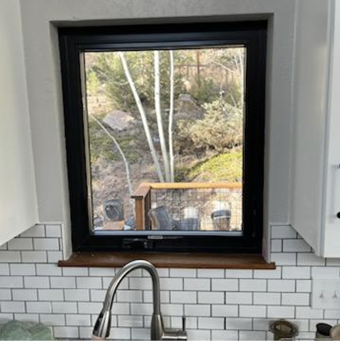 Evergreen, CO. Andersen 100 series fibrex composite window casement crank out color black