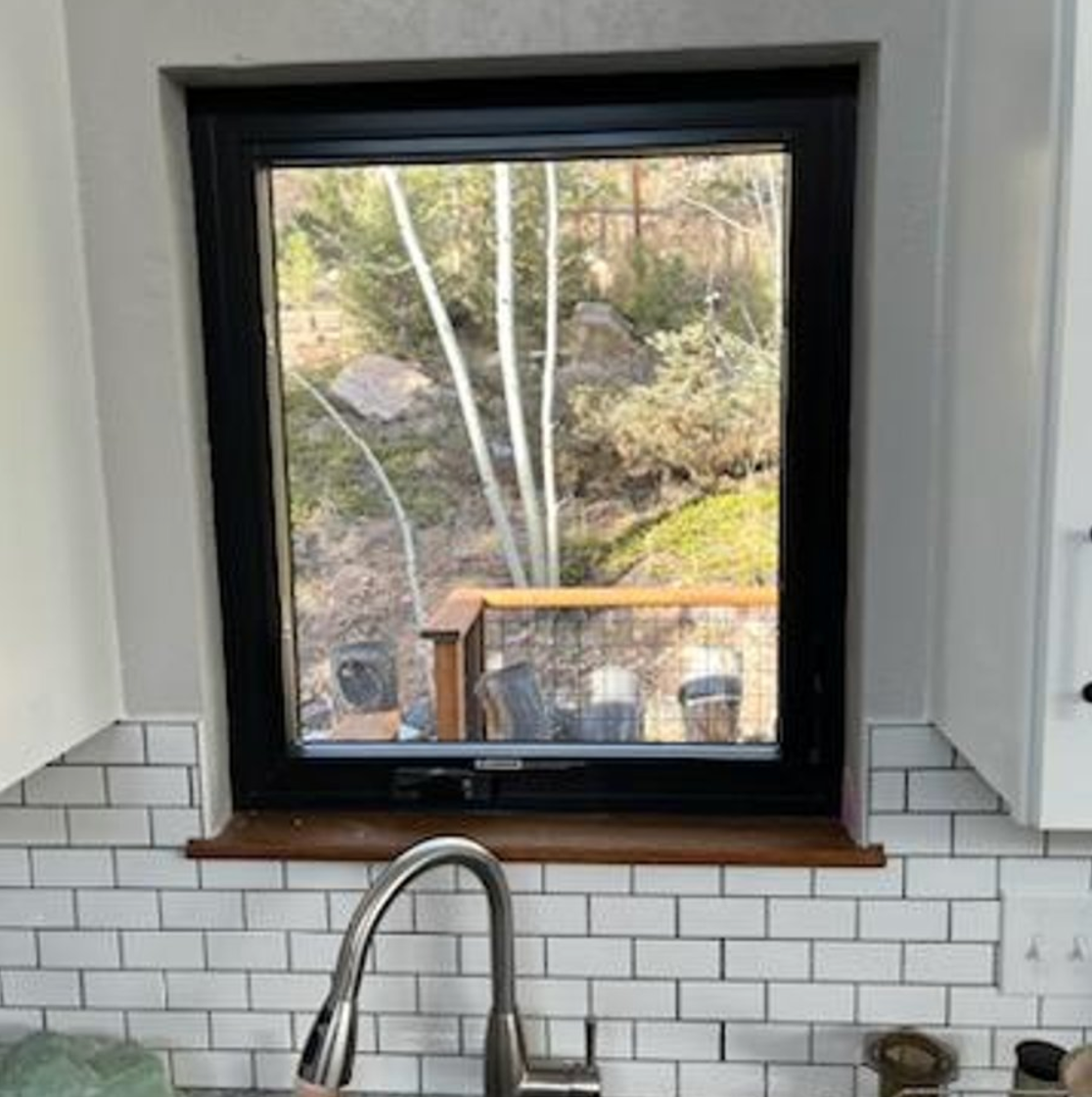 Evergreen, CO. Andersen 100 series fibrex composite window casement crank out color black
