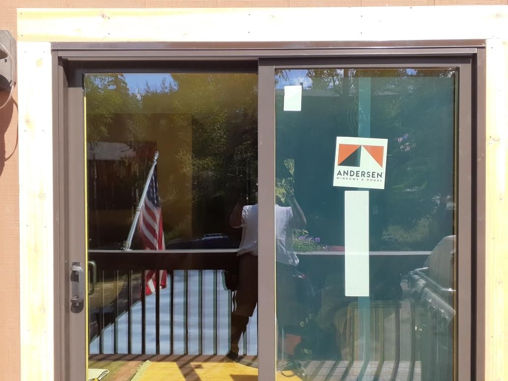 Evergreen, CO. Andersen 200 series wood-clad patio sliding door exterior color Terratone